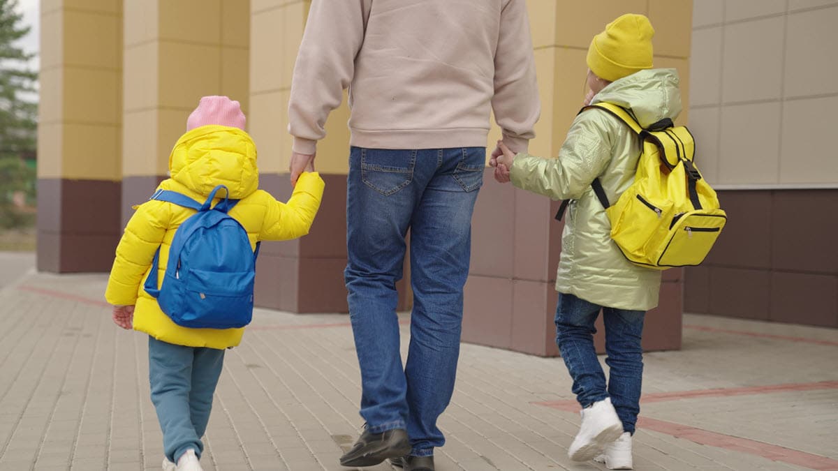 dad picking up kids from school