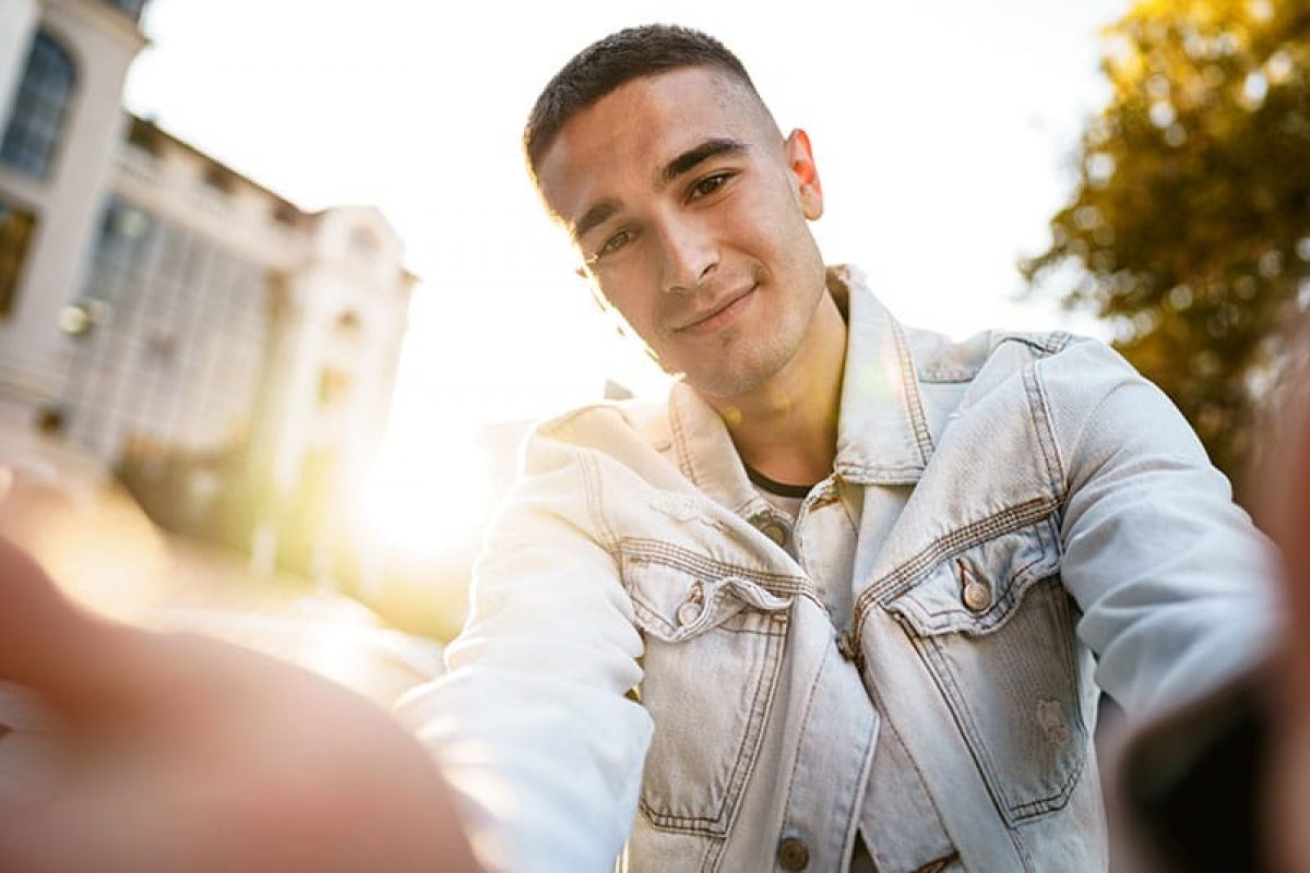 a young man taking a selfie