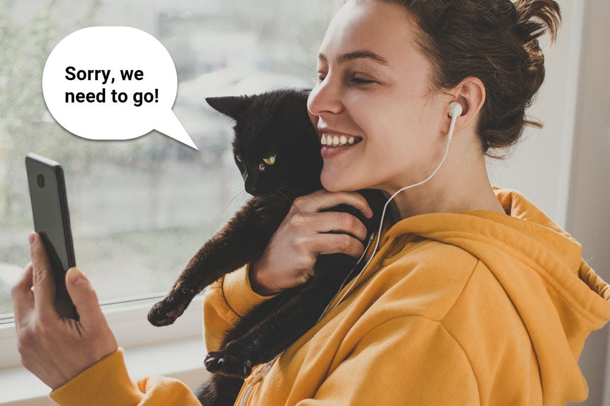 girl on facetime holding a cat with a thought bubble that says, "sorry, we need to go!"